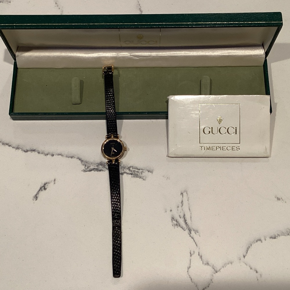 Vintage Gucci Women's Black and Gold Watch